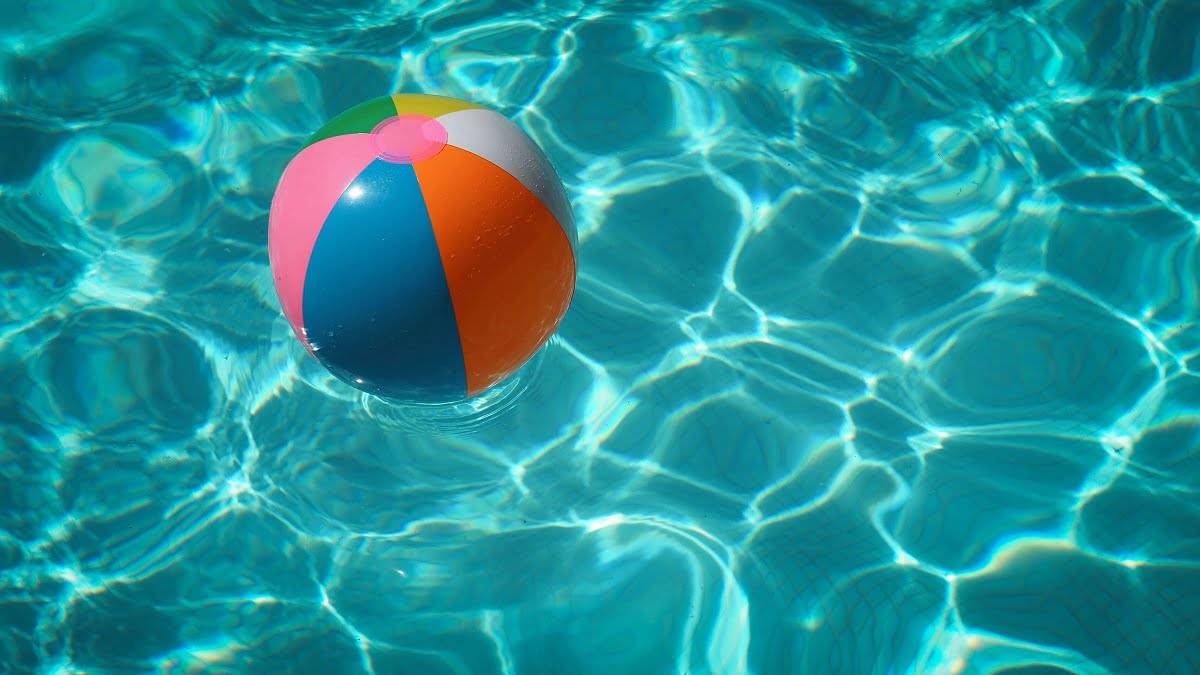 beach ball floating in a pool without need of swimming pool leak repair